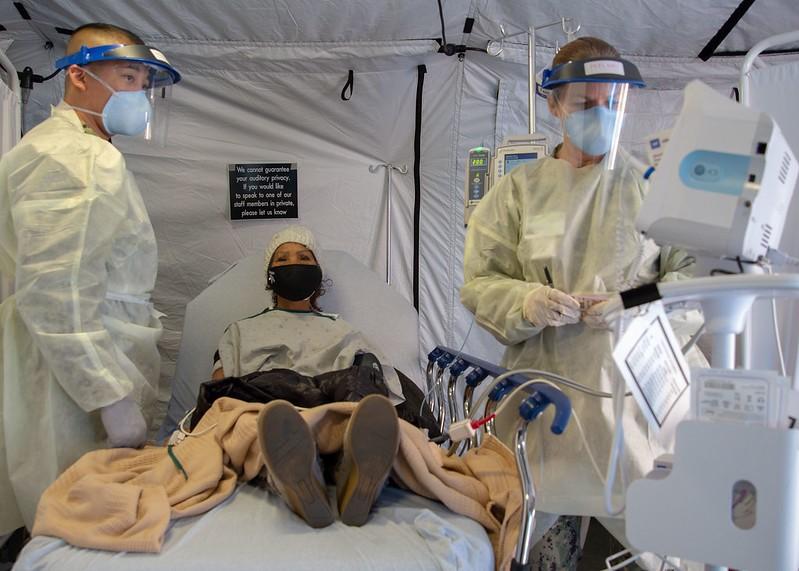 Doctors administering monoclonal antibody therapy
