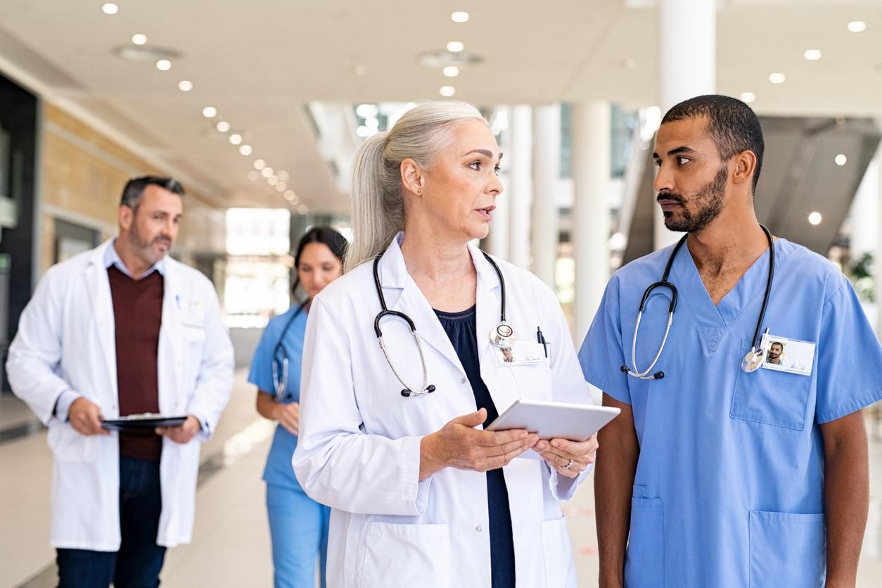 Doctors consulting with nurses