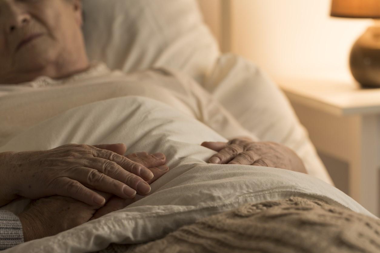 Elderly woman sick in bed