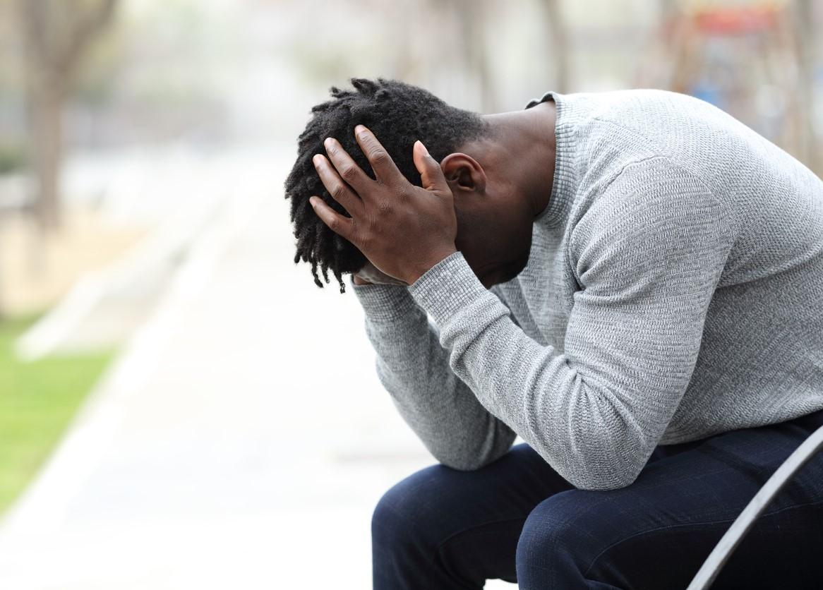 Fatigued man on park bench