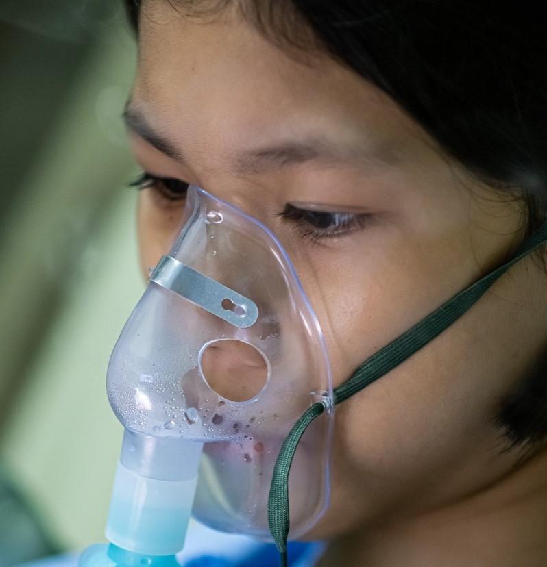 Girl receiving supplemental oxygen