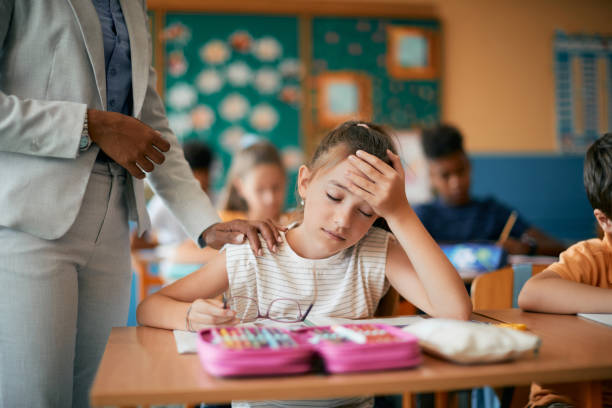 Girl with headache in school