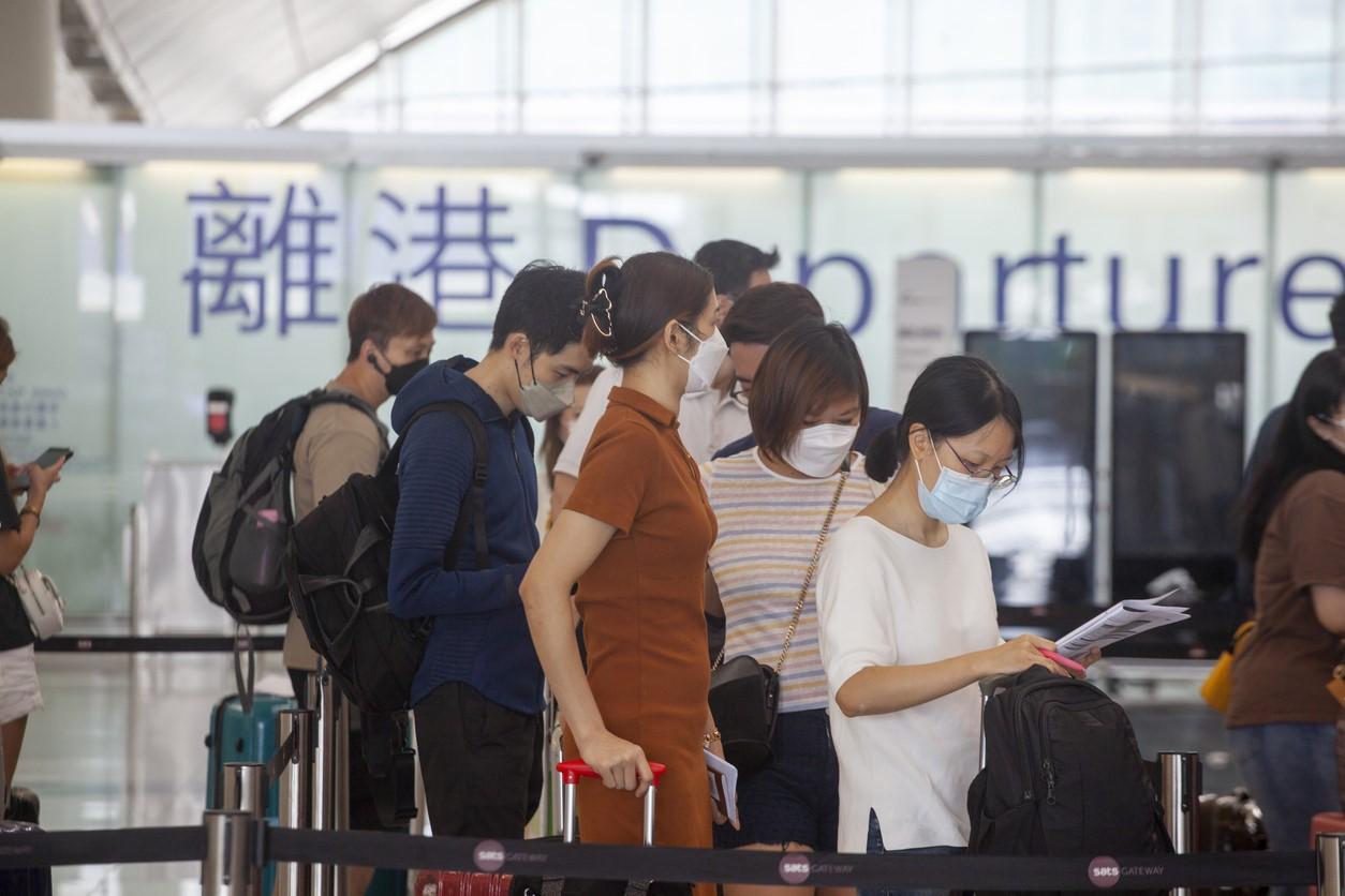 Airport passengers with masks
