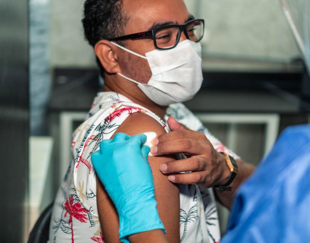 Man getting gauze pad after vaccination