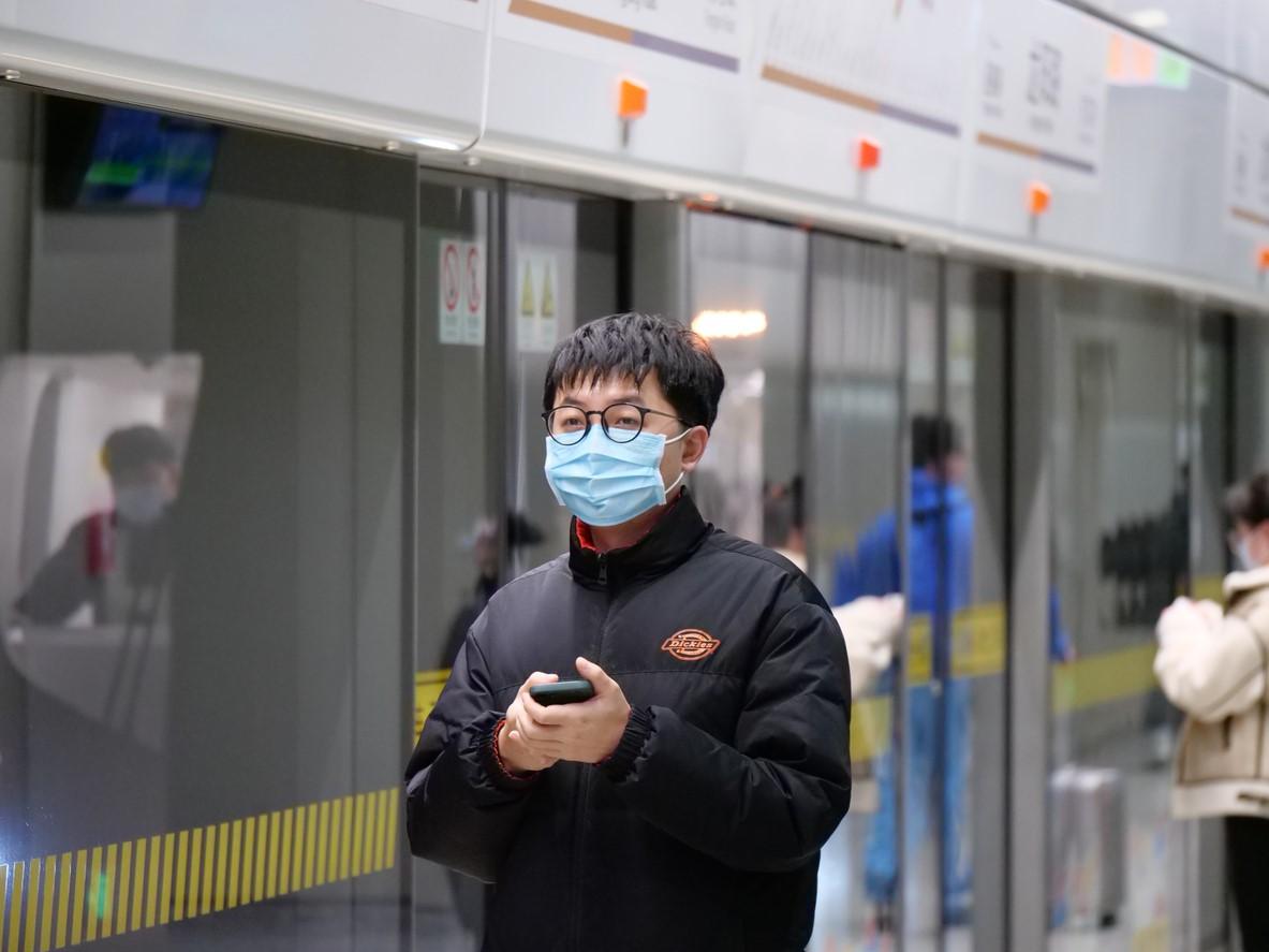 Man wearing mask in Shanghai subway station