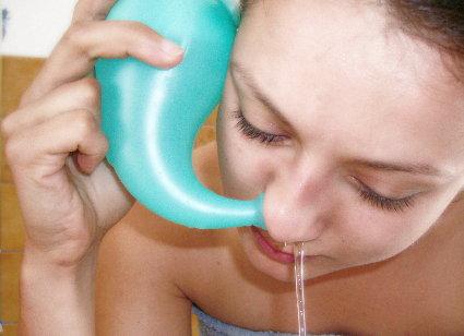 Neti pot in use