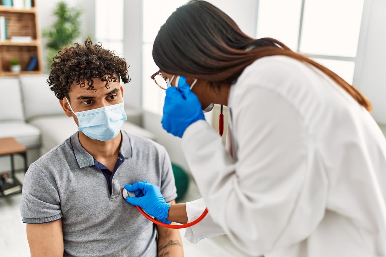 Nurse listening to heart