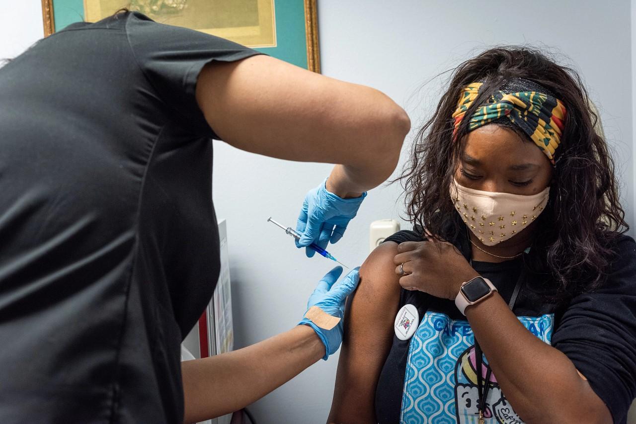 Teen getting vaccinated