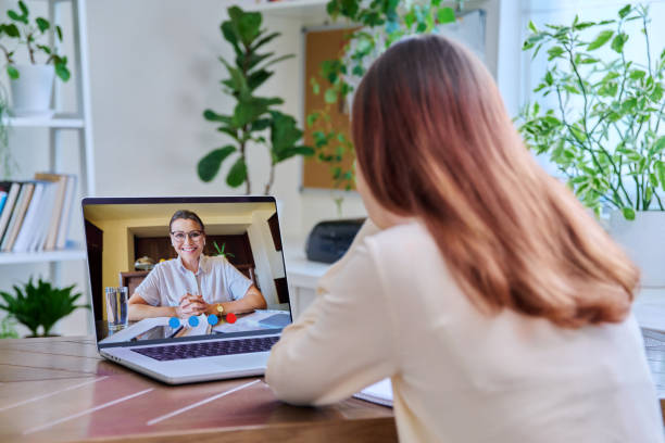 Teenaged girl watching video of her doctor