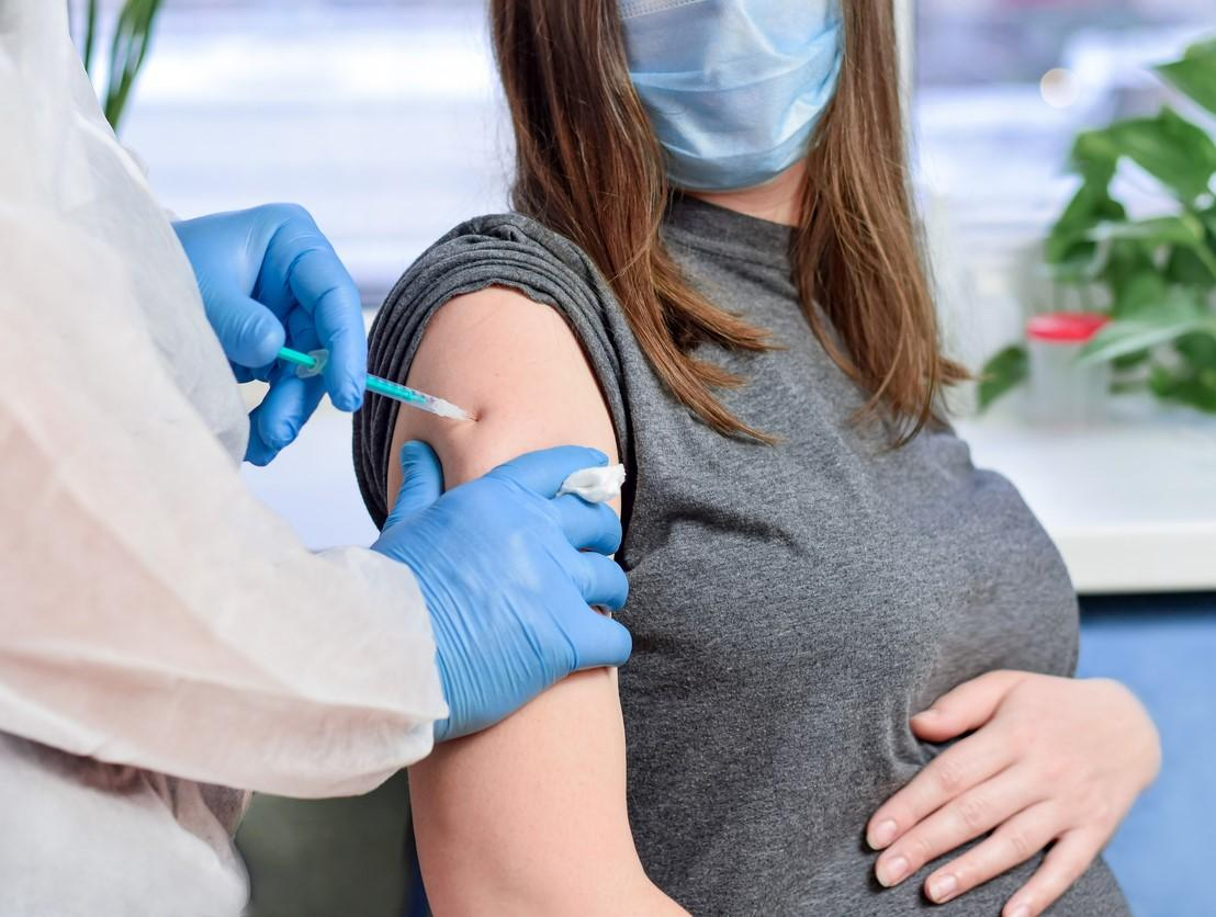 Pregnant woman getting vaccine