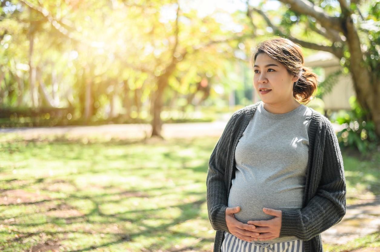 Pregnant woman in park