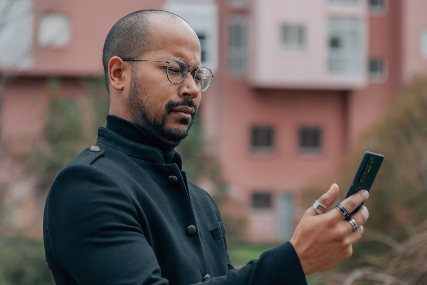 Skeptical man looking at phone
