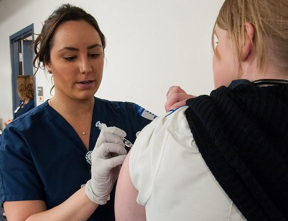 Woman being immunized