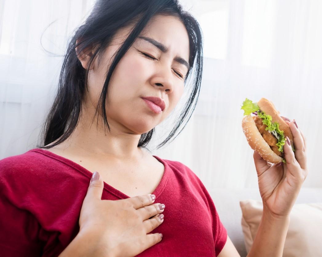 Woman eating sandwich