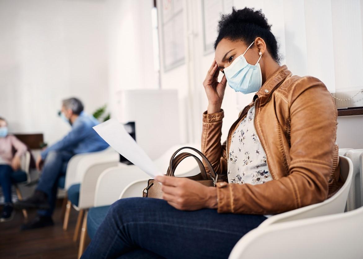 Woman wearing mask in waiting room