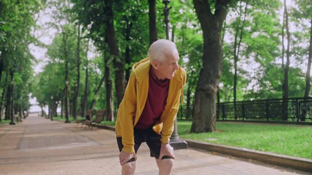 Older man in park with shortness of breath