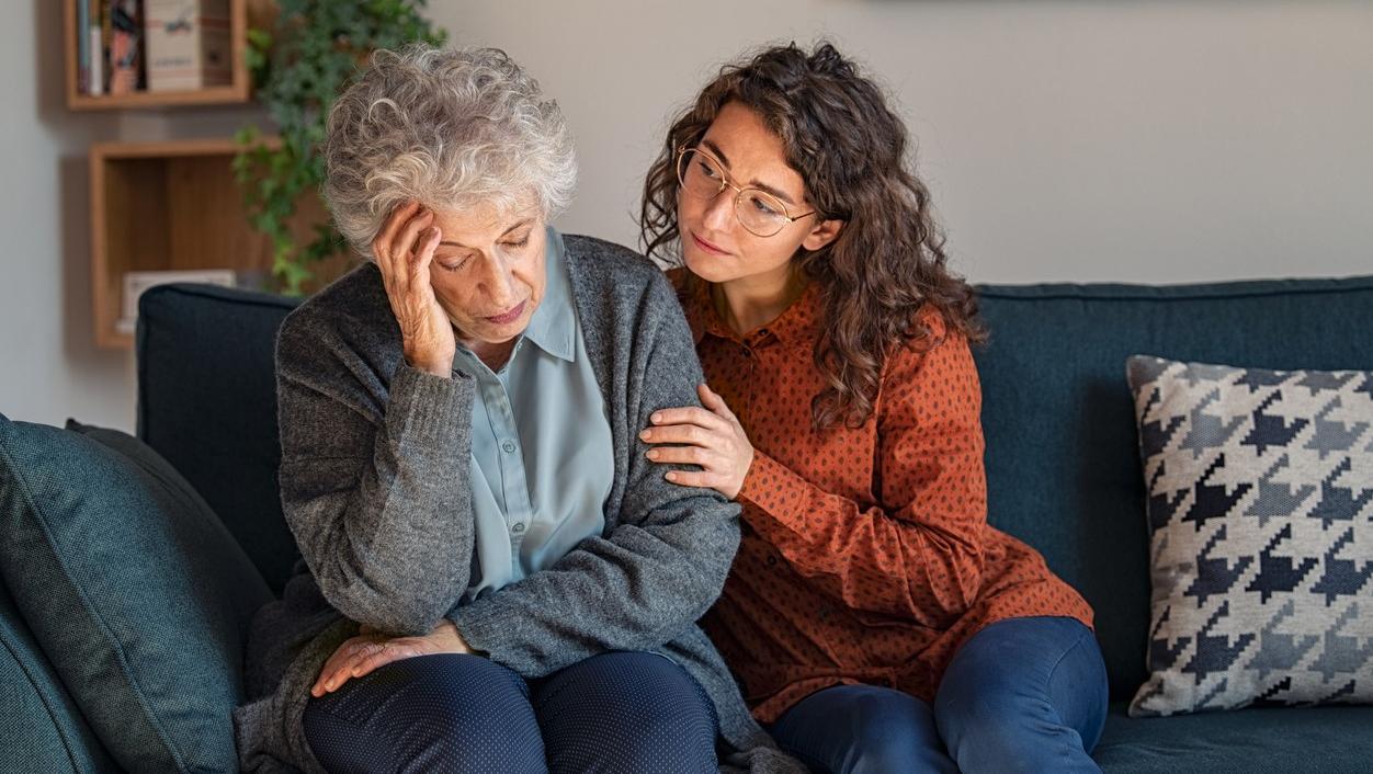 Young woman consoling older woman