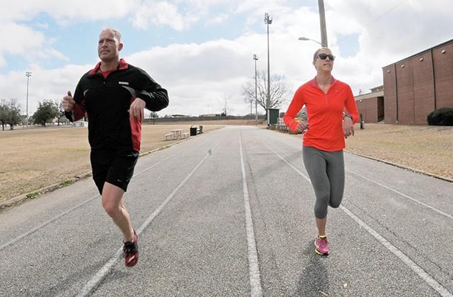 Couple running on track