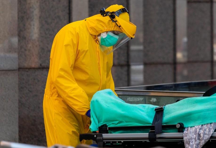 Healthcare worker with dead COVID-19 patient