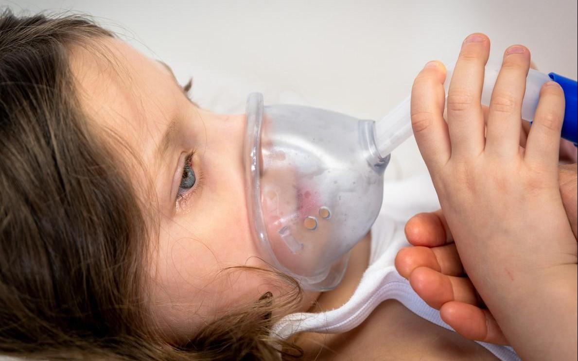 Girl in hospital getting respiratory support