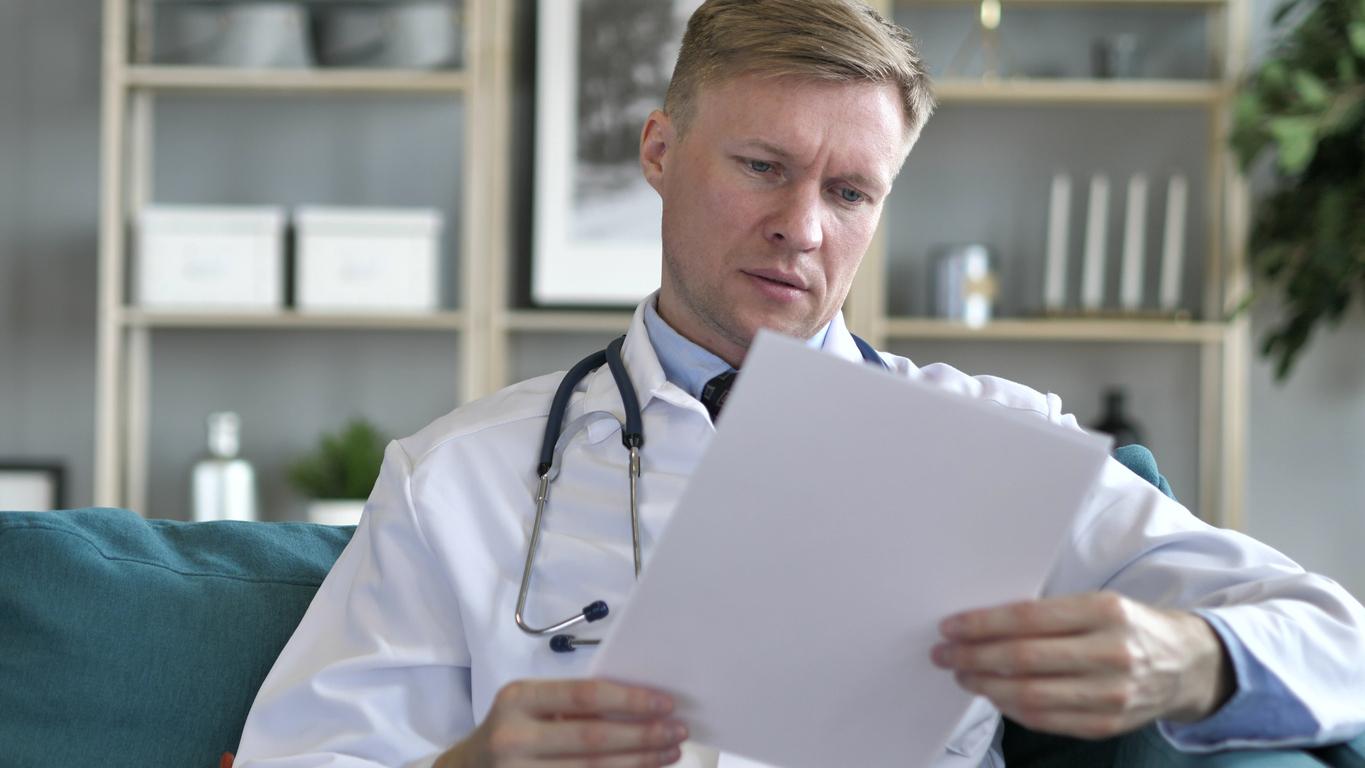 Doctor reading a medical chart