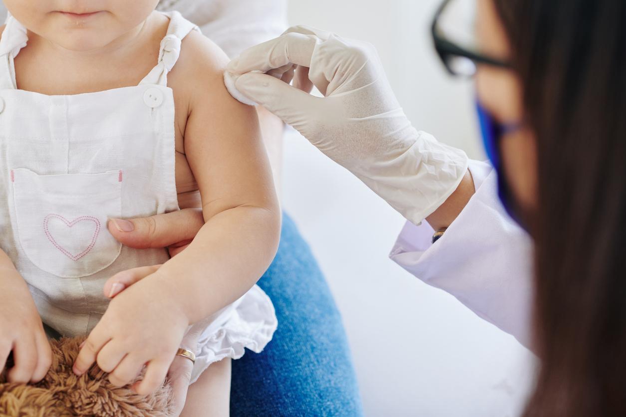 Young child preparing for vaccination