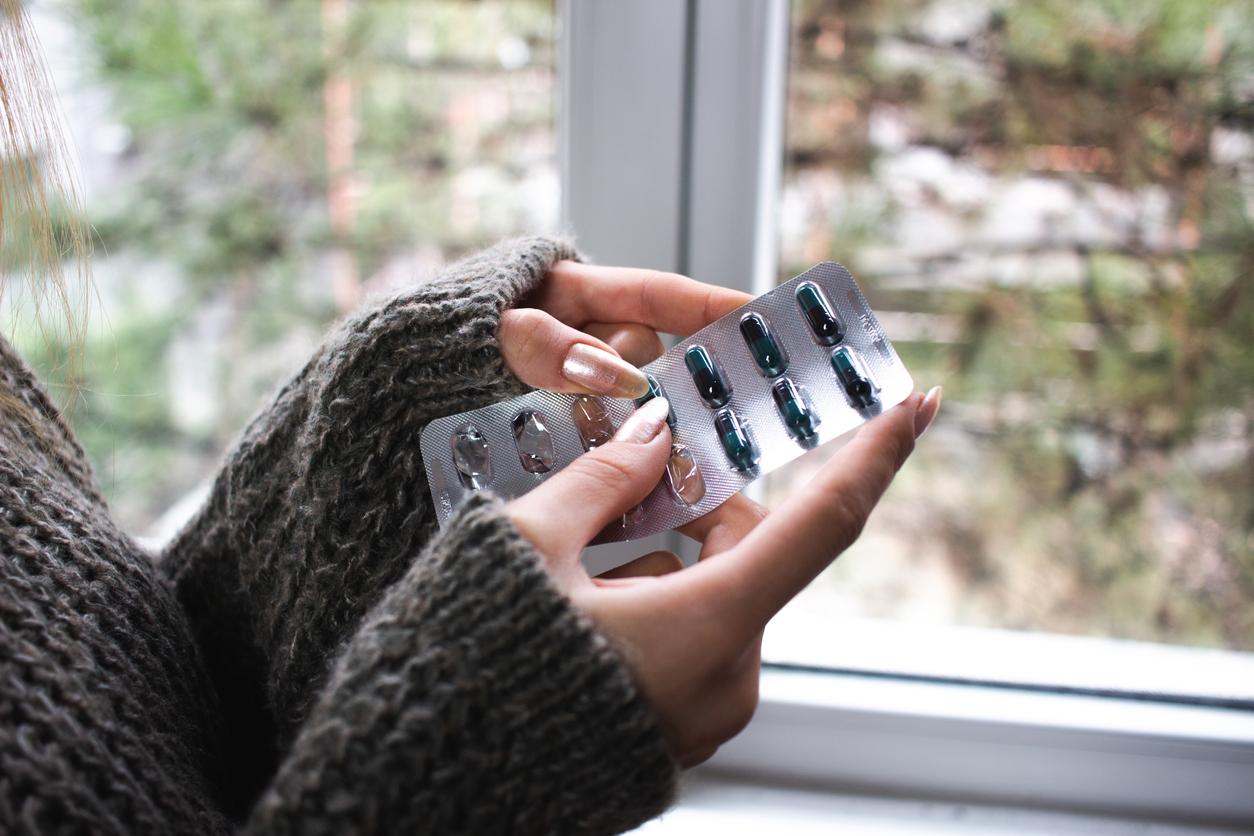 Woman holding antibiotics