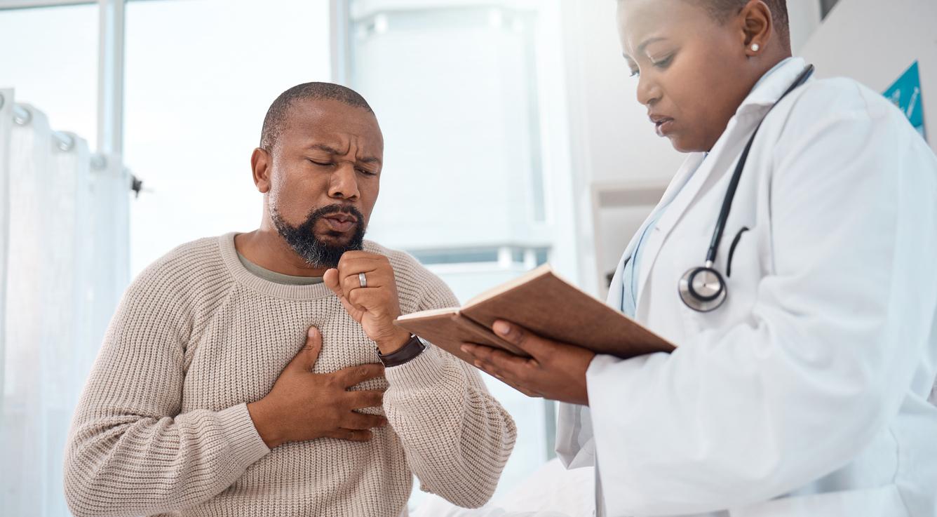 Man coughing at doctor's office