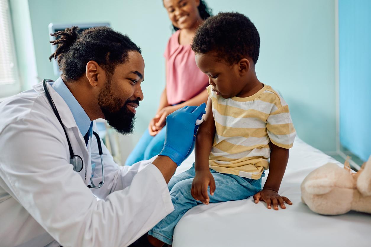 Child about to receive vaccine in doctor's office