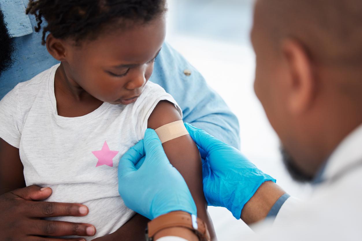 Young black child receiving vaccine
