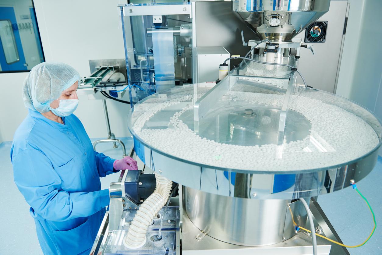 Person working in drug-manufacturing facility
