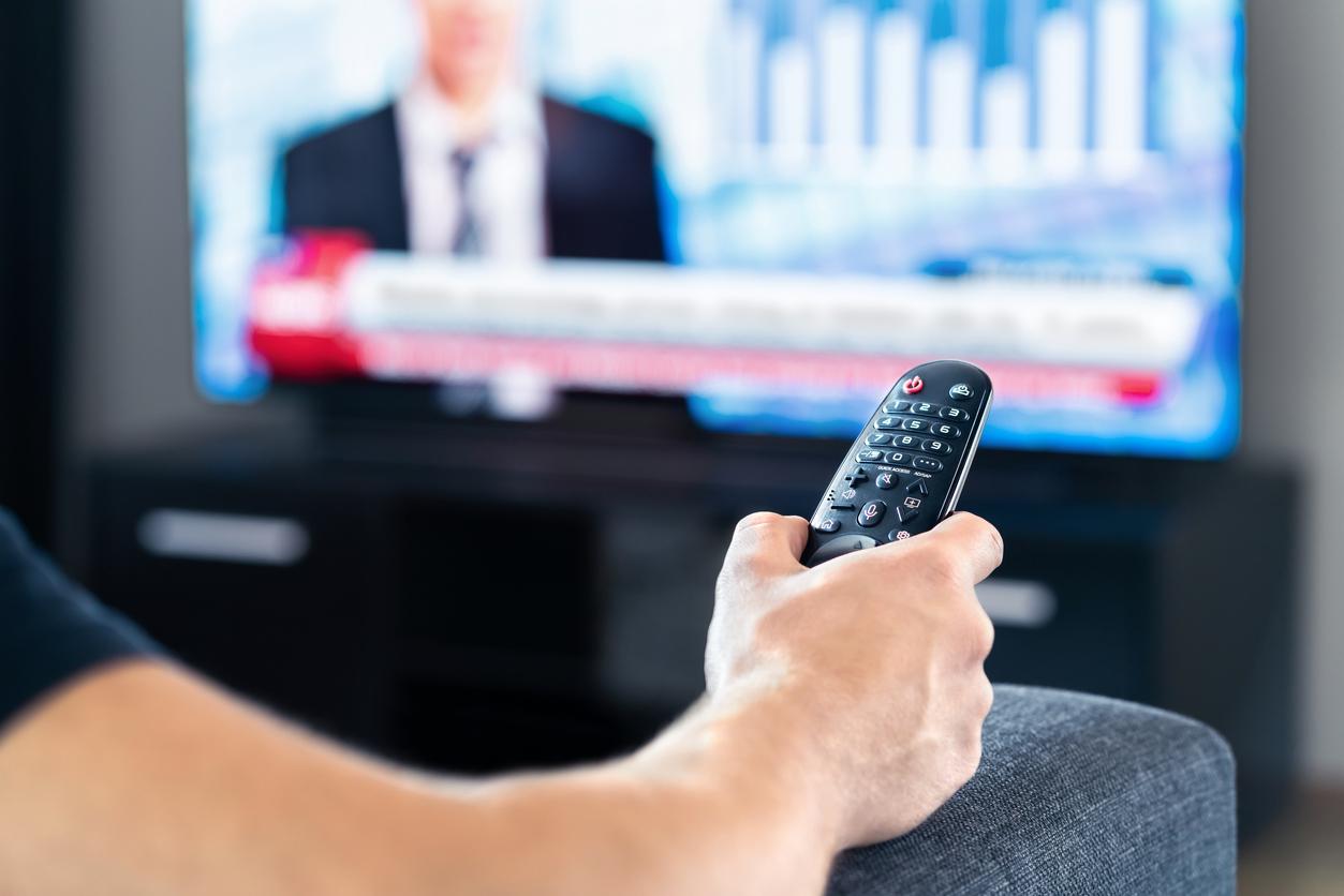 man watching news
