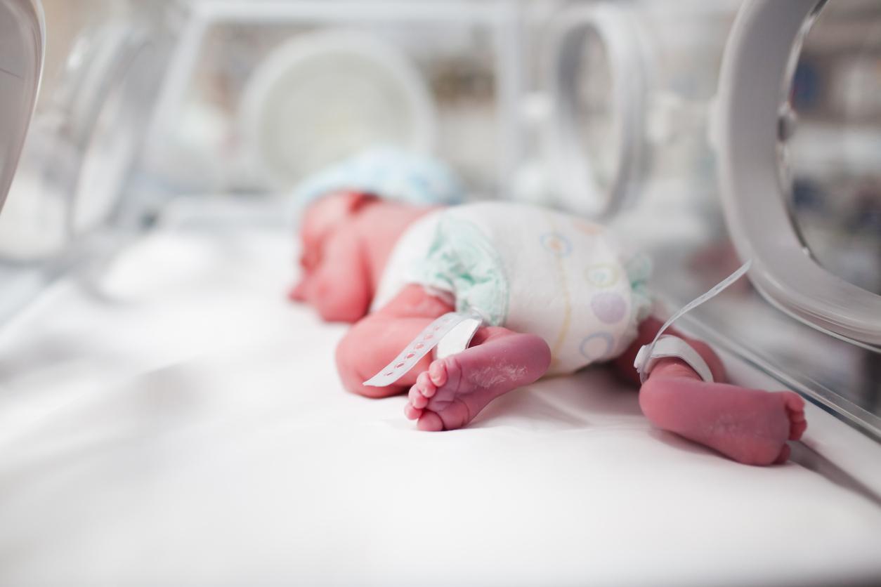 newborn in incubator