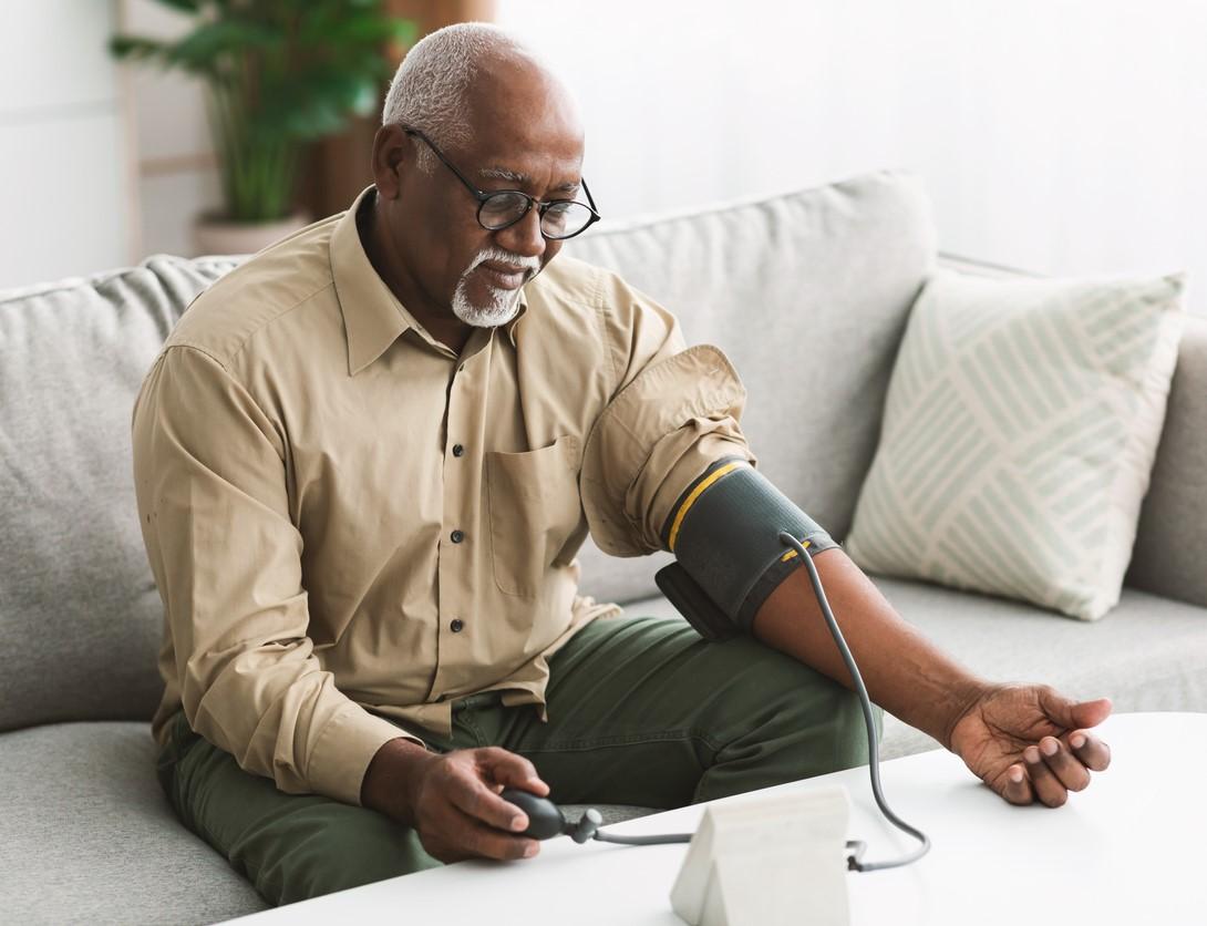 Older man measuring blood pressure
