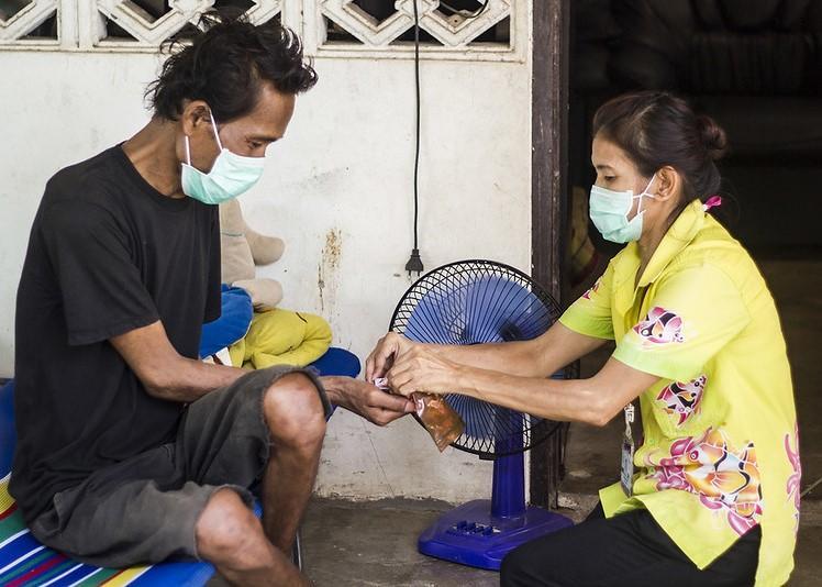 TB patient receiving medicine