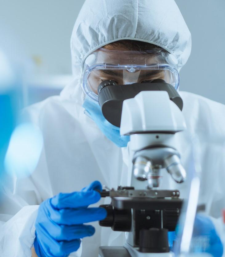 Scientist at microscope