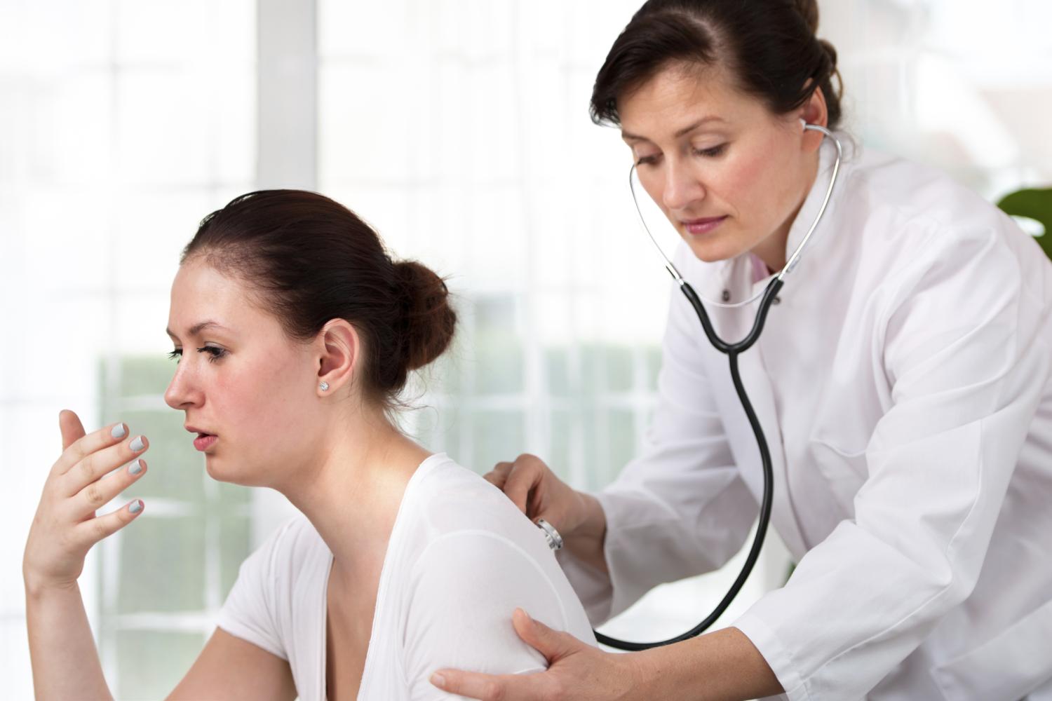 coughing patient and examining provider