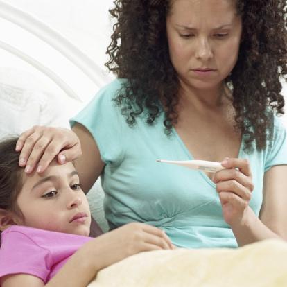 Mom taking kid's temp