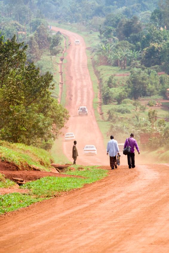 Travelers along African dirt road