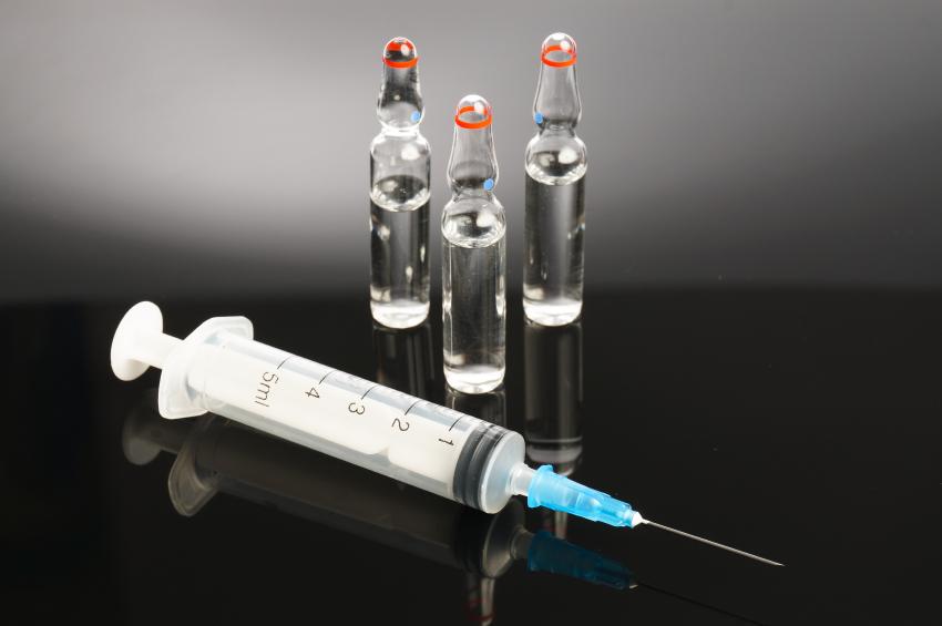 Vaccine vials and syringe