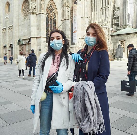 Austrian tourists wearing masks, gloves