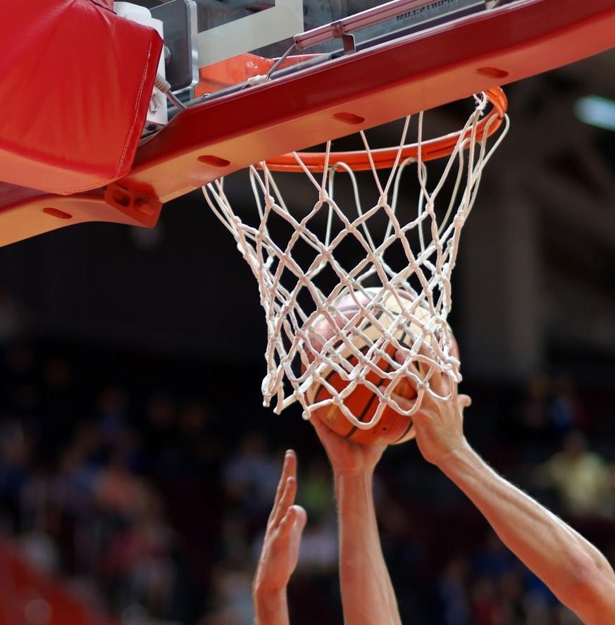 Basketball players' hands rebounding