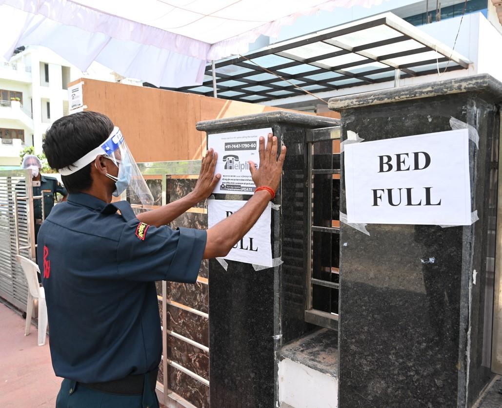 'Bed full' signs at a hospital in India