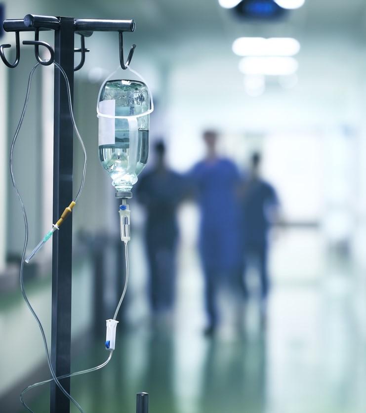 Blurry health workers in hallway