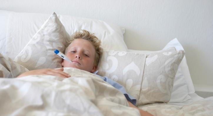 Boy sick in bed