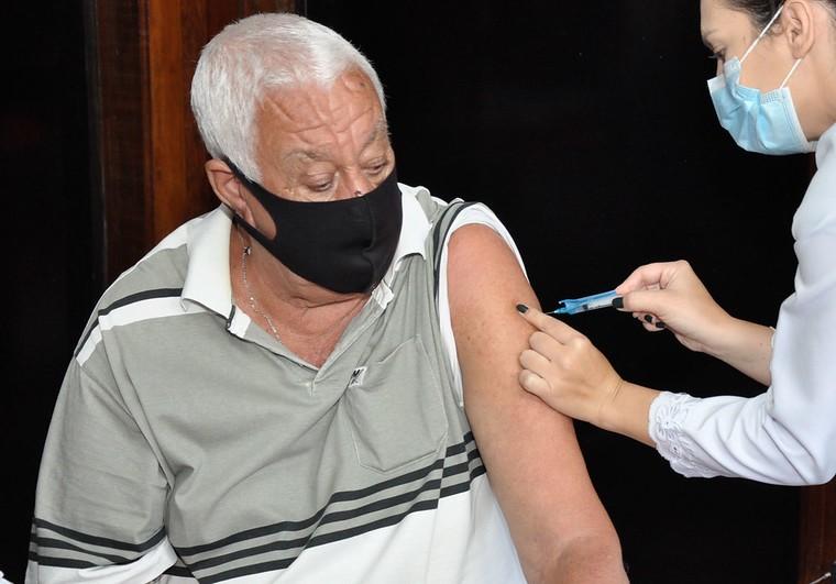Vaccination of older man in Brazil