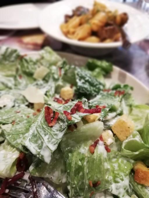 Caesar salad with beef pasta