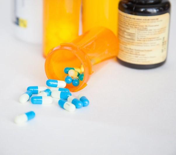 Capsules spilling from bottle