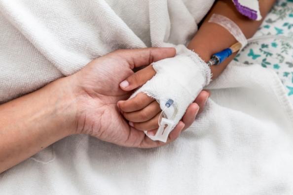 Child's hand in hospital with IV