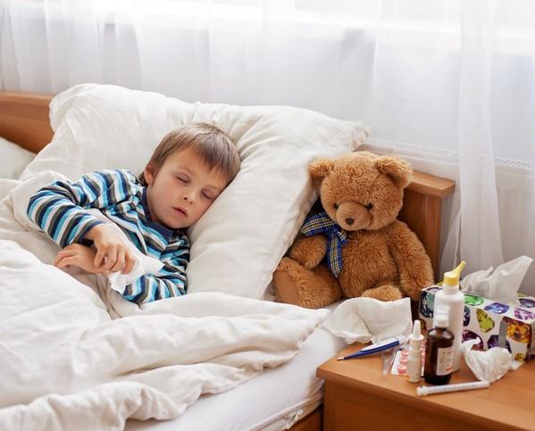 Sick boy in bed